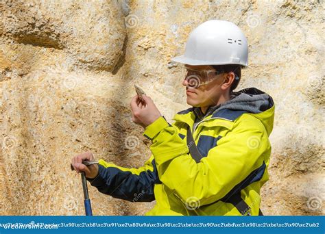 Geologist Examines A Sample Of Stone Outdoor Stock Photo Image Of