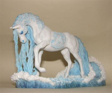 A Statue Of A White Horse With Blue Manes
