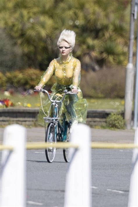 Maisie Williams Rides Bike In A See Through Plastic Coat 5