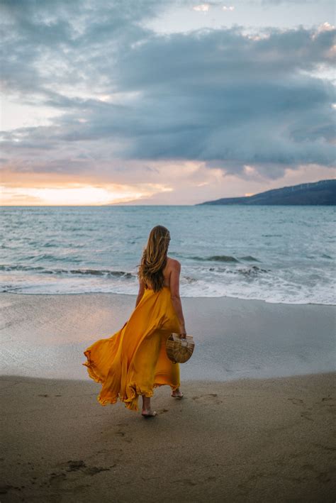 gal meets glam golden sunset rhode resort dress and cult gaia bag beach photography poses beach