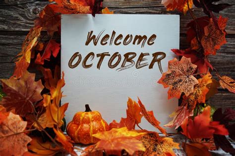 Welcome October Text Message With Autumn Maple Leaves And Pumpkins On