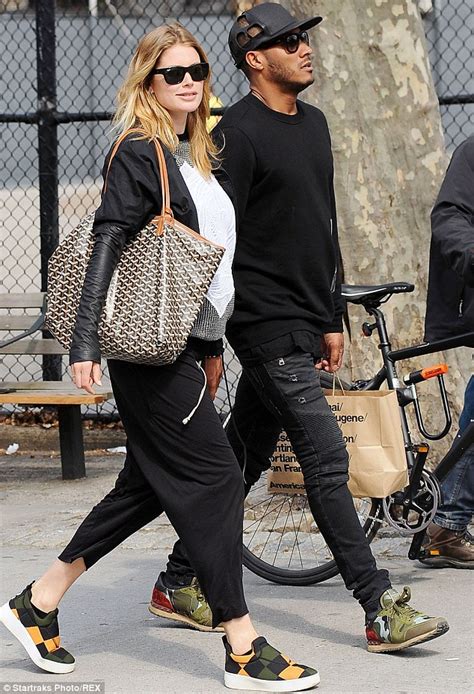 pregnant doutzen kroes proudly shows off her burgeoning bump under a floral knit as she shops
