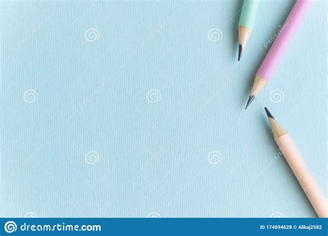 Pastel Colored Pencils On Empty Sheet Blue Toned Stock Photo Image