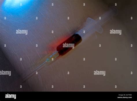 Syringe Filled With Blood Stock Photo Alamy