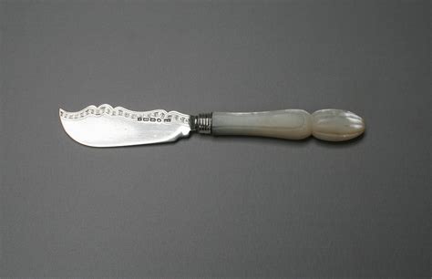 An Antique Silver Blade Butter Knife With Mother Of Pearl Handle