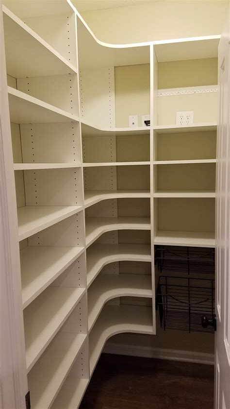 White melamine pantry with adjustable shelving and wire baskets. | Diy