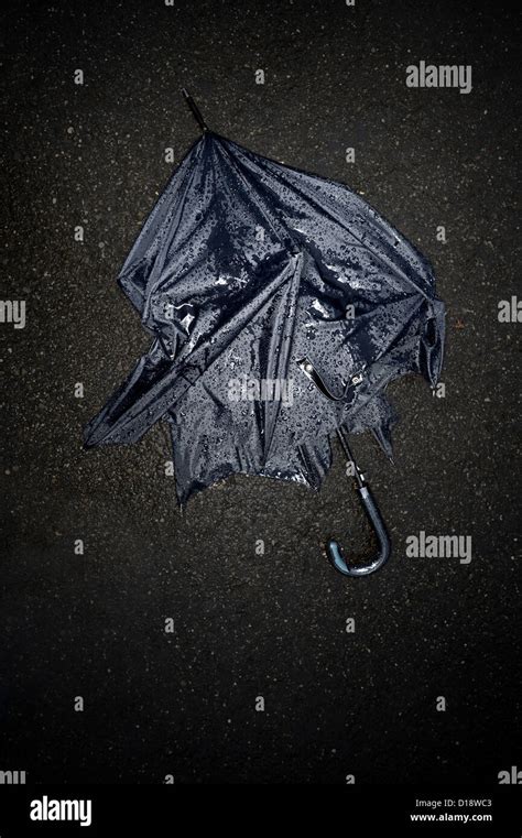 Broken Black Umbrella In The Rain On Black Street Stock Photo Alamy