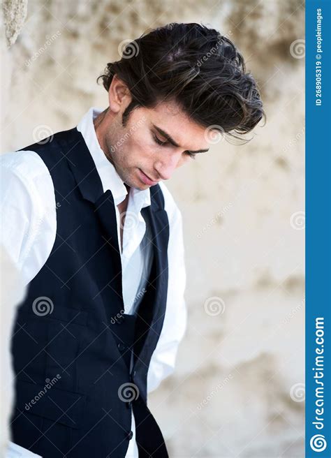 Tall Dark And Brooding Closeup Of A Handsome Young Male Wearing A