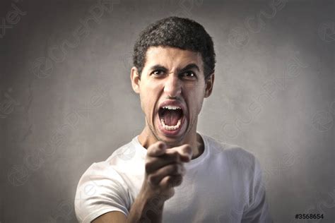 Angry Man Pointing His Finger Against Somebody Stock Photo Crushpixel