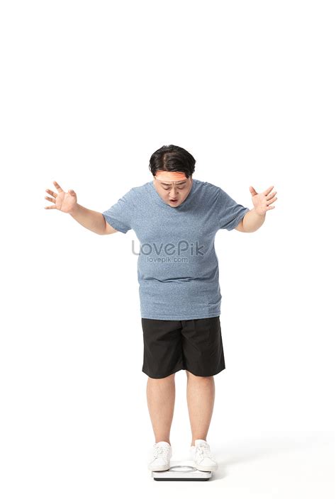 Obese Man Standing On A Weight Scale Surprised Picture And Hd Photos