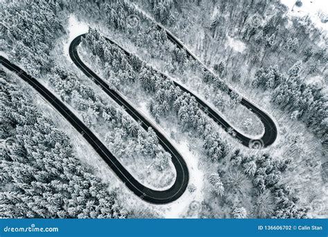 Winding Road Trough A Mountain Pass In The Winter Season Snowy Road