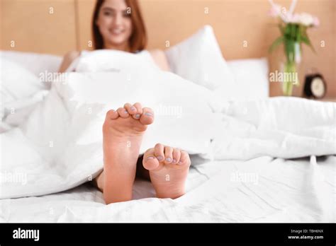 Feet Of Beautiful Young Woman Lying In Bed Stock Photo Alamy