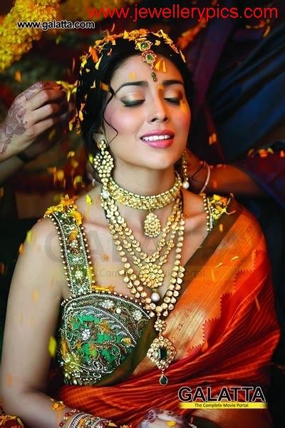 What makes a picture perfect well the way you pose, right. jewelry: Shriya Saran Hot Indian Wedding Photo Shoot 3