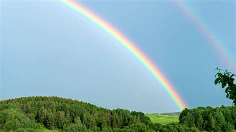 Double Rainbow On A Gray Sky After Rain A Rare Atmospheric Phenomenon