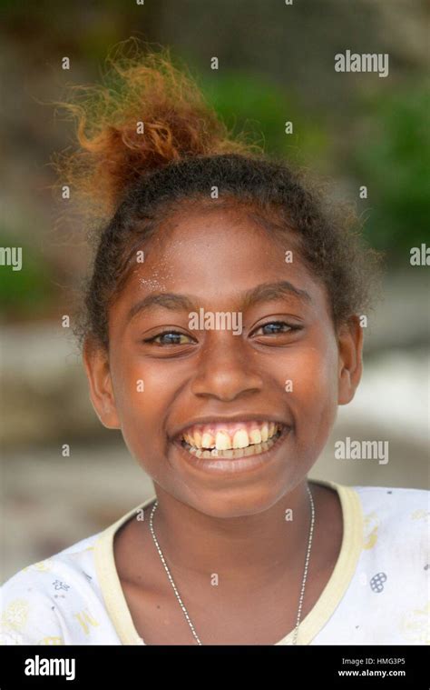 Portrait Of A Smiling Little Girl In Raja Empat Islandswest Papua