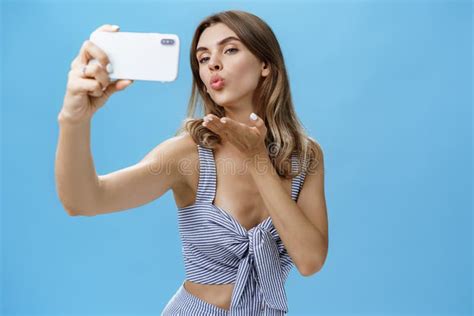 Outgoing And Self Assured Glamorous Woman Like Taking Pictures Of Herself Holding Smartphone