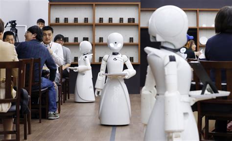 Cafe Opens With Robot Waiters Remotely Controlled By People With