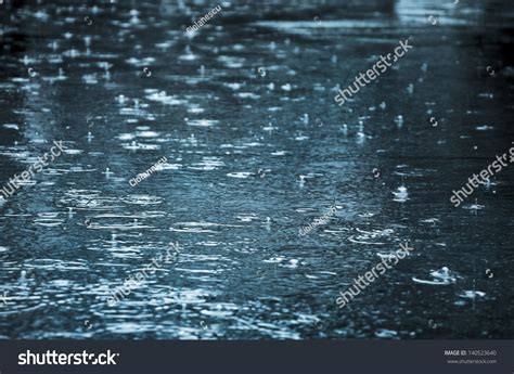 Rain Drops Rippling Puddle Blue Sky Stock Photo 140523640 Shutterstock