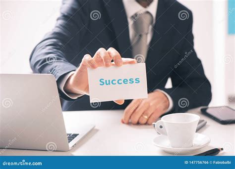 Businessman Holding Business Card With Success Text Written On It Stock