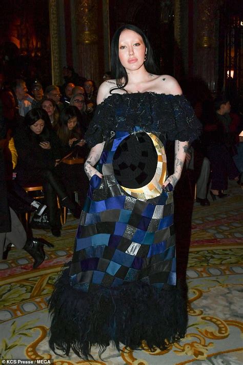 noah cyrus covers up in an illusion gown at viktor and rolf s show after rocking that chain dress