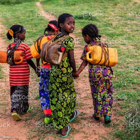 African Girls Carrying Water From The Well Ethiopia Africa Stock Photo ...