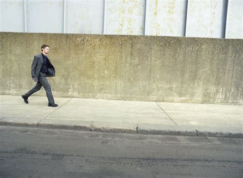 Businessman Walking On Sidewalk Stock Image Image Of Caucasian