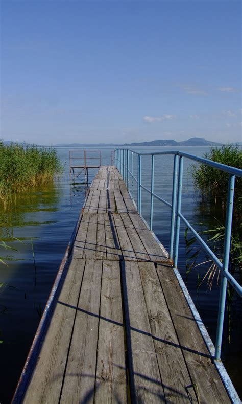 A freshwater lake in hungary, the largest lake in central europe, and one of the region's foremost tourist destinations. a quay at Balaton lake | Balaton, Places to travel, Hungary