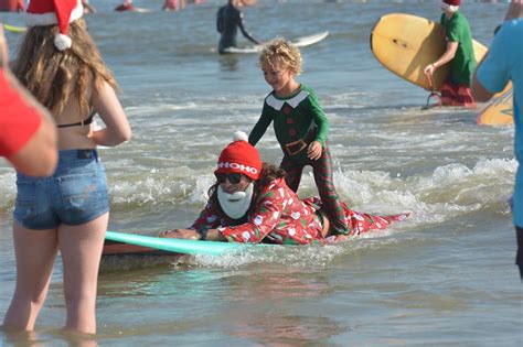 surfing santas extravaganza cocoa beach florida christmas eve surfing december 24th 2017 by raw