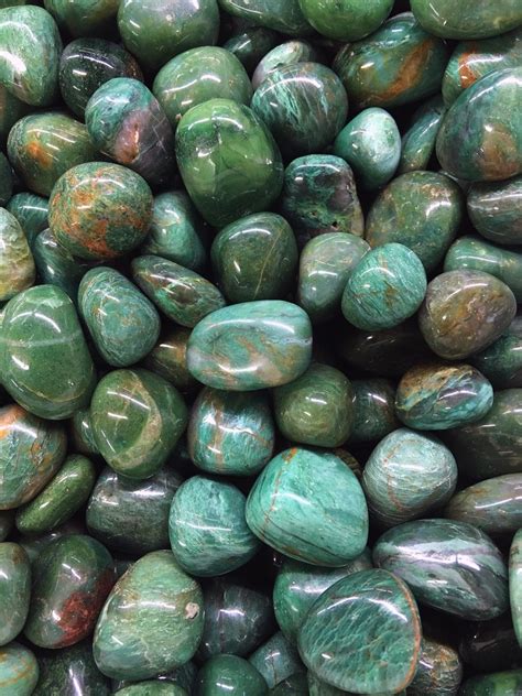 Tumbled stones are rocks that have been rounded, smoothed and polished in a rock tumbler. Tumbled Stones : Fuchsite Green Tumbled Stones 250g
