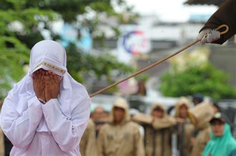 indonesian woman becomes the latest to suffer public caning under strict islamic rules daily
