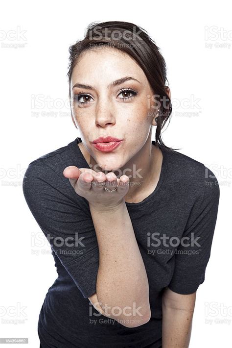 Beautiful Young Adult Blowing A Kiss Stock Photo Download Image Now