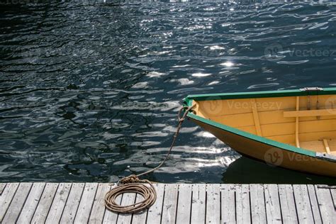 Small Wooden Boat Tied To The Dock 22465521 Stock Photo At Vecteezy