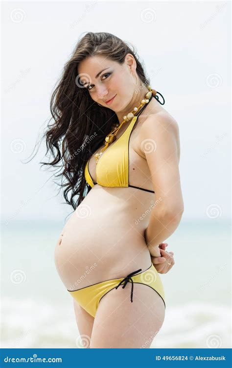 Pregnant Woman In Yellow Bikini At The Sea Stock Photo Image Of