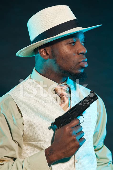 Black American Mafia Gangster Man In Suit With Pistol Stock Photo