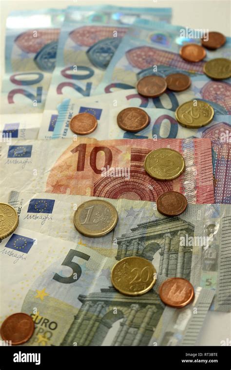 A Pile Of Euro Notes And Coins Stock Photo Alamy