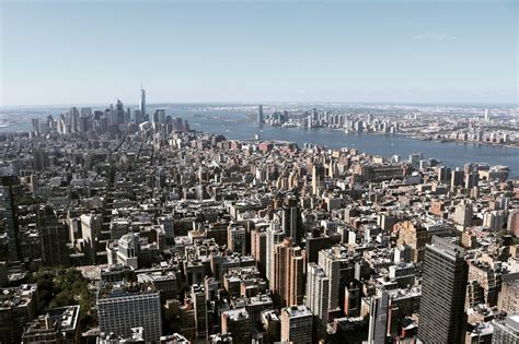 High Angle View Of Cityscape Against Cloudy Sky · Free Stock Photo