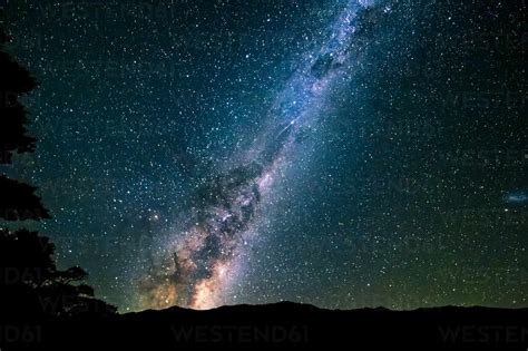 New Zealand Milky Way Galaxy On Starry Night Sky Stock Photo