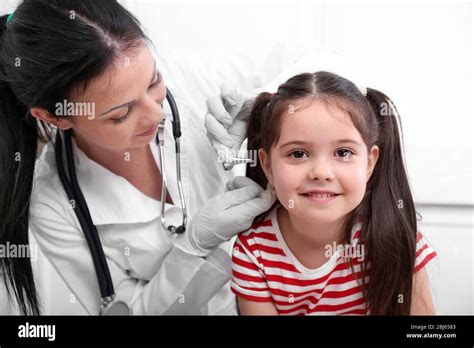 Doctor Examining Childs Ears Stock Photo Alamy