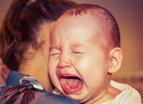Mom Soothes Baby The Baby Is Crying Stock Photo Image Of Mother