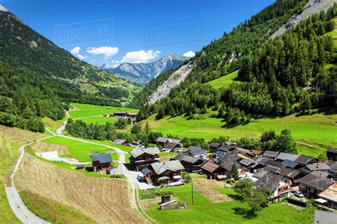 Overlooking The Village Of Issert Surrounded By Swiss Alps Under Blue