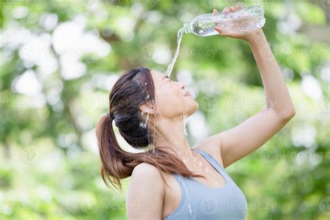 Athlete Young Beautiful Woman Drinking And Splashing Water In Her Face