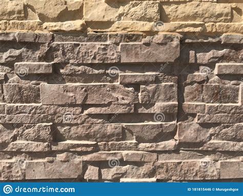 Stone Pitching For Wall Finishes Of Compound Wall Of An Residential