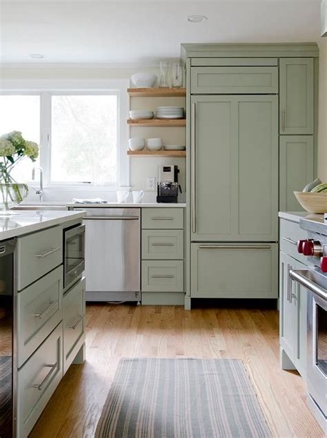 Beautiful Kitchen Features Sage Green Cabinets Paired With White Quartz