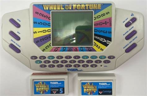 Wheel Of Fortune Handheld Game 1995 Tiger Electronic W 2 Cartridges