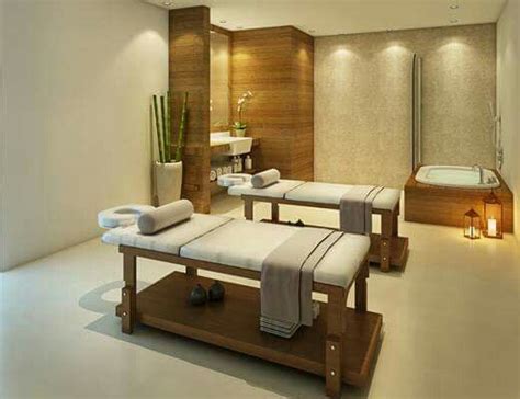 Spa Room With Massage Tables And Mirror