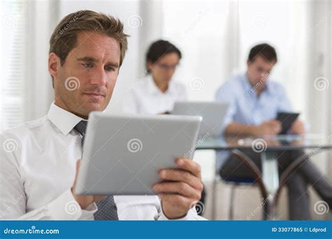 Businessman Using His Tablet In The Office Stock Image Image Of