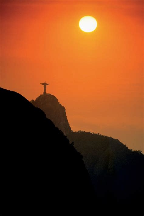 Silhouette Of The Beautiful Statue Of Christ The Redeemer At Sunset In
