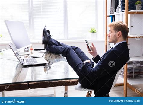 Lazy Man Using Phone At Work Desk Stock Photo Image Of Lazy Phone