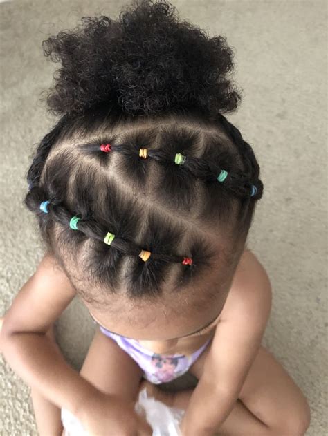 Braids and buns and bows, oh my! Toddler hair styles #rainbow #hair #rubberbands #kidshairstyle #naturalhair | Kids braided ...