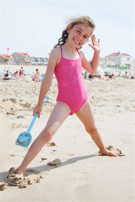 Kid Girl In Swimwear Summer Sand Beach Premium Photo